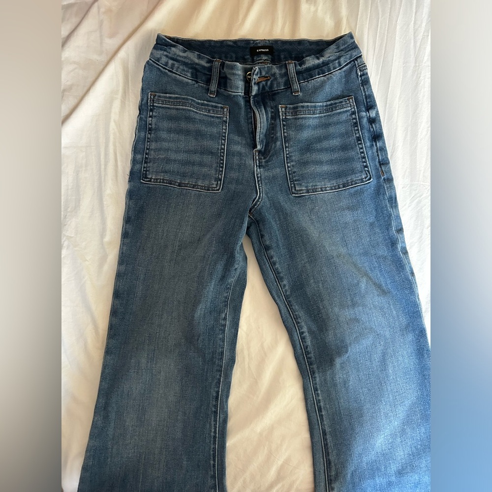 express blue mid rise flare jeans medium